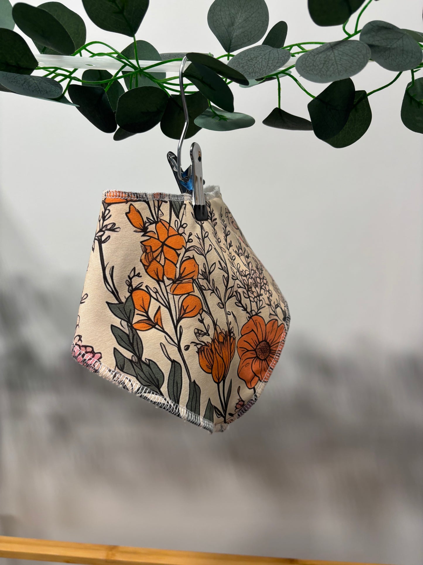 Floral sketch towelling bib