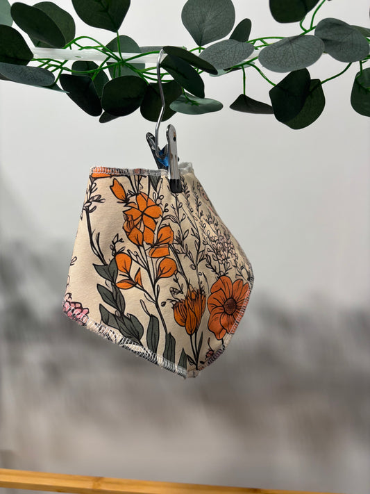 Floral sketch towelling bib