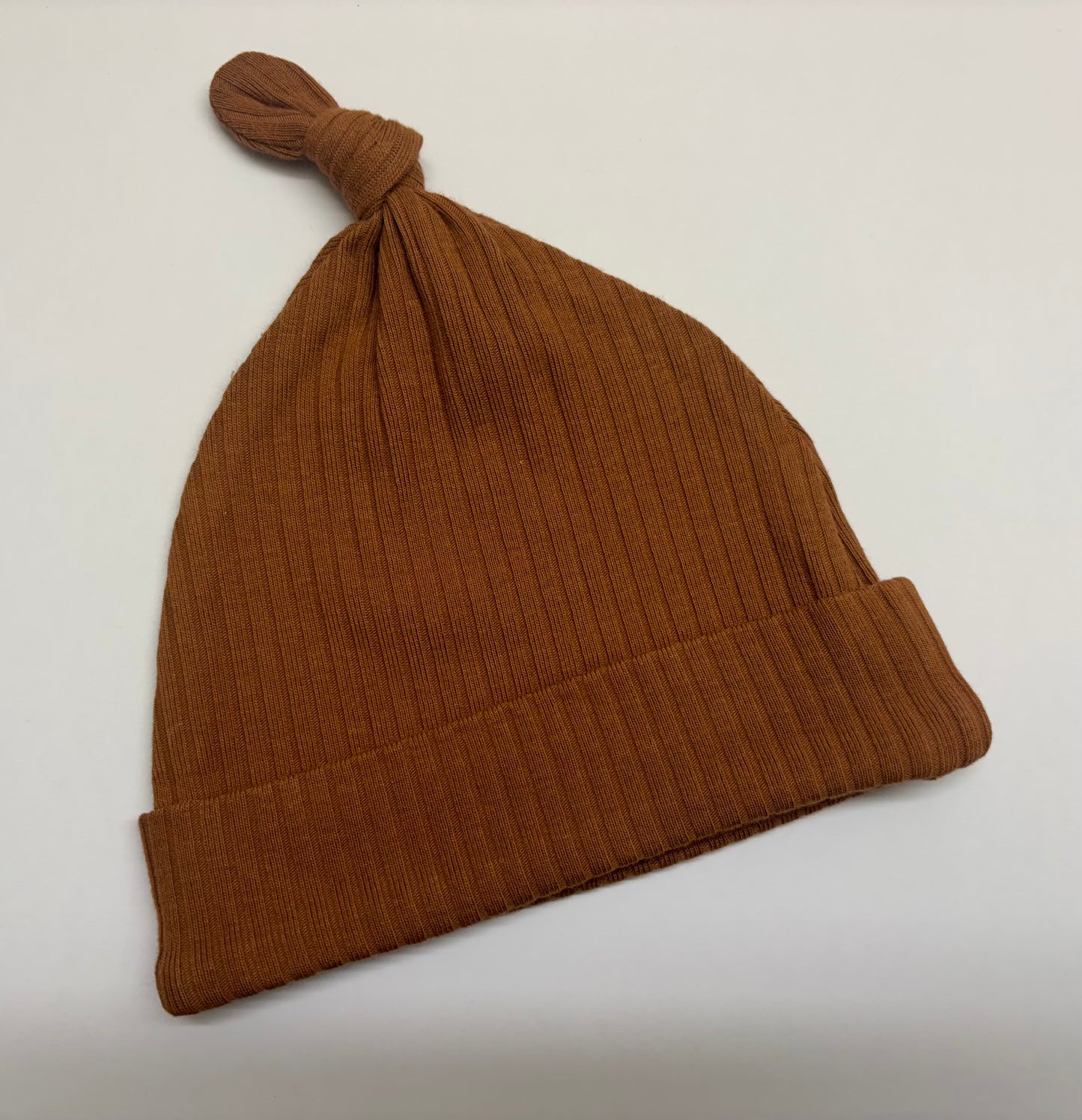 Rust ribbed knot hat